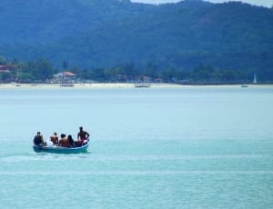 group of person on boat in body of water thumbnail