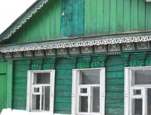 green and white painted house thumbnail