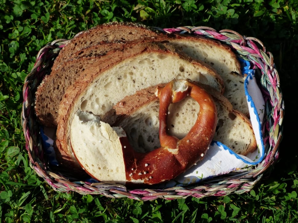 bagle and wheat bread in brown and pink wicker basket preview
