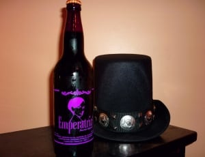 emperatriz bottle and black trilby hat thumbnail