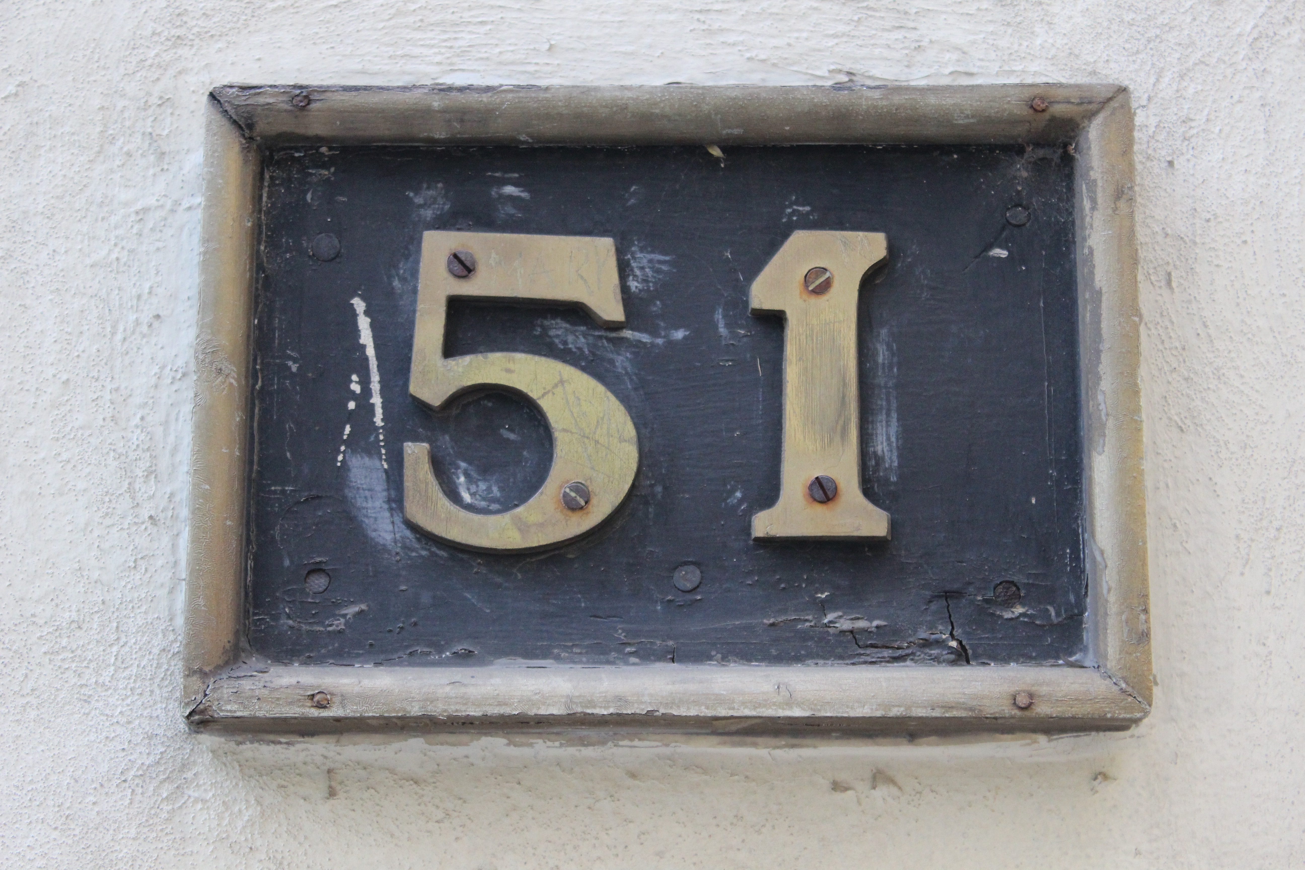 black and beige 51 wall number signage