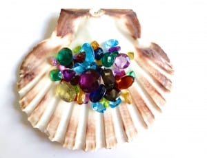 brown and white shell with blue emerald amber and amethyst gemstones thumbnail