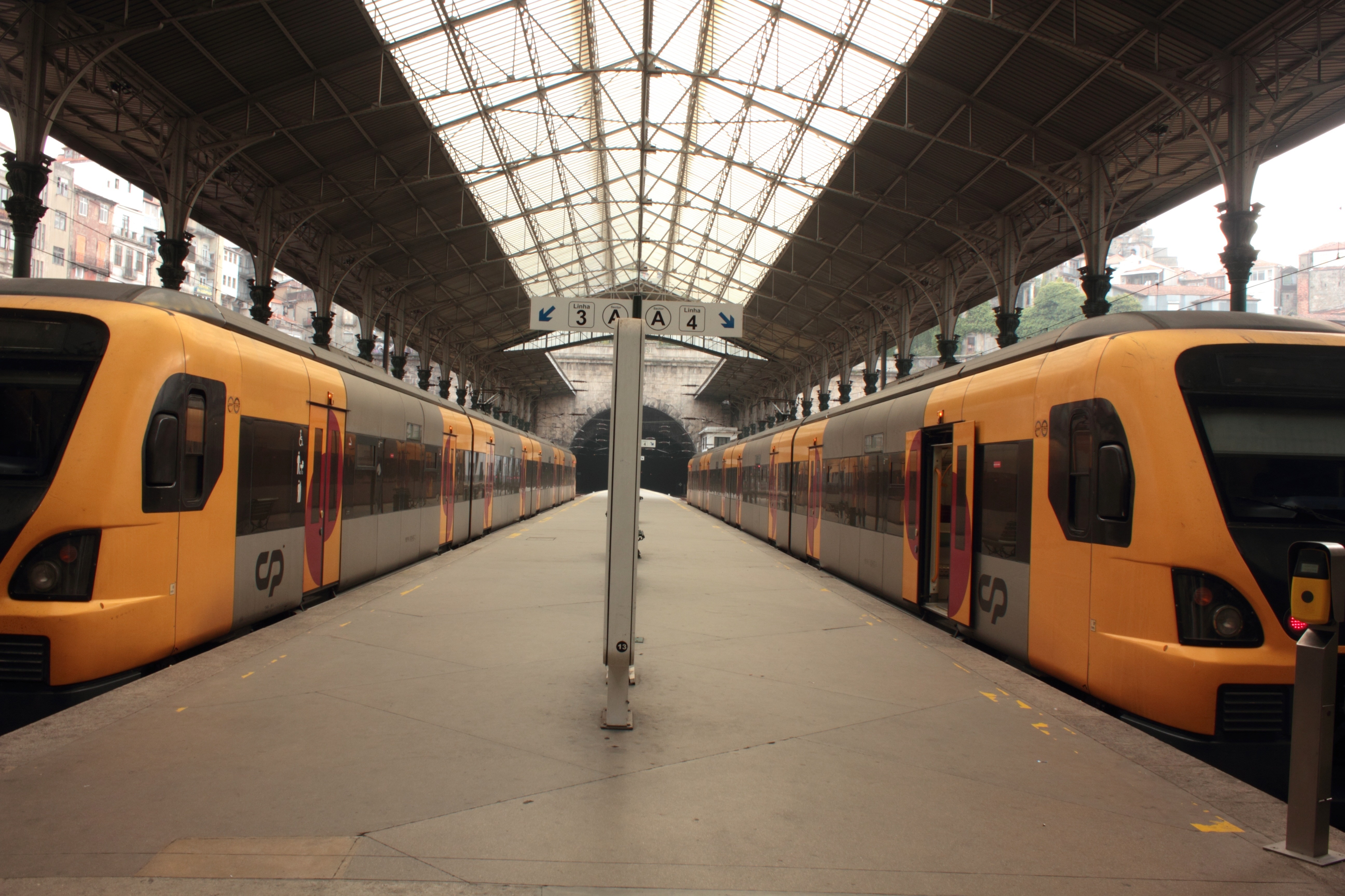 2 orange and gray trains