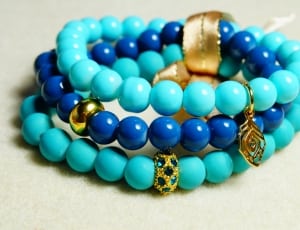 three blue and teal beaded bracelets thumbnail
