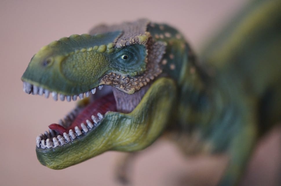 green dinosaur figurine preview