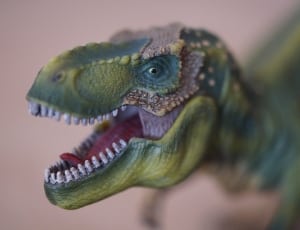 green dinosaur figurine thumbnail