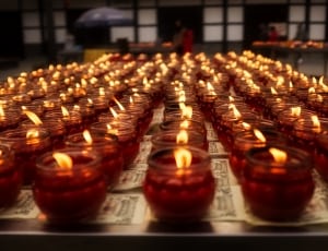 lighted tea candles in glass thumbnail