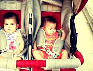 two baby's on twin stroller thumbnail