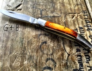brown handle silver folding knife thumbnail