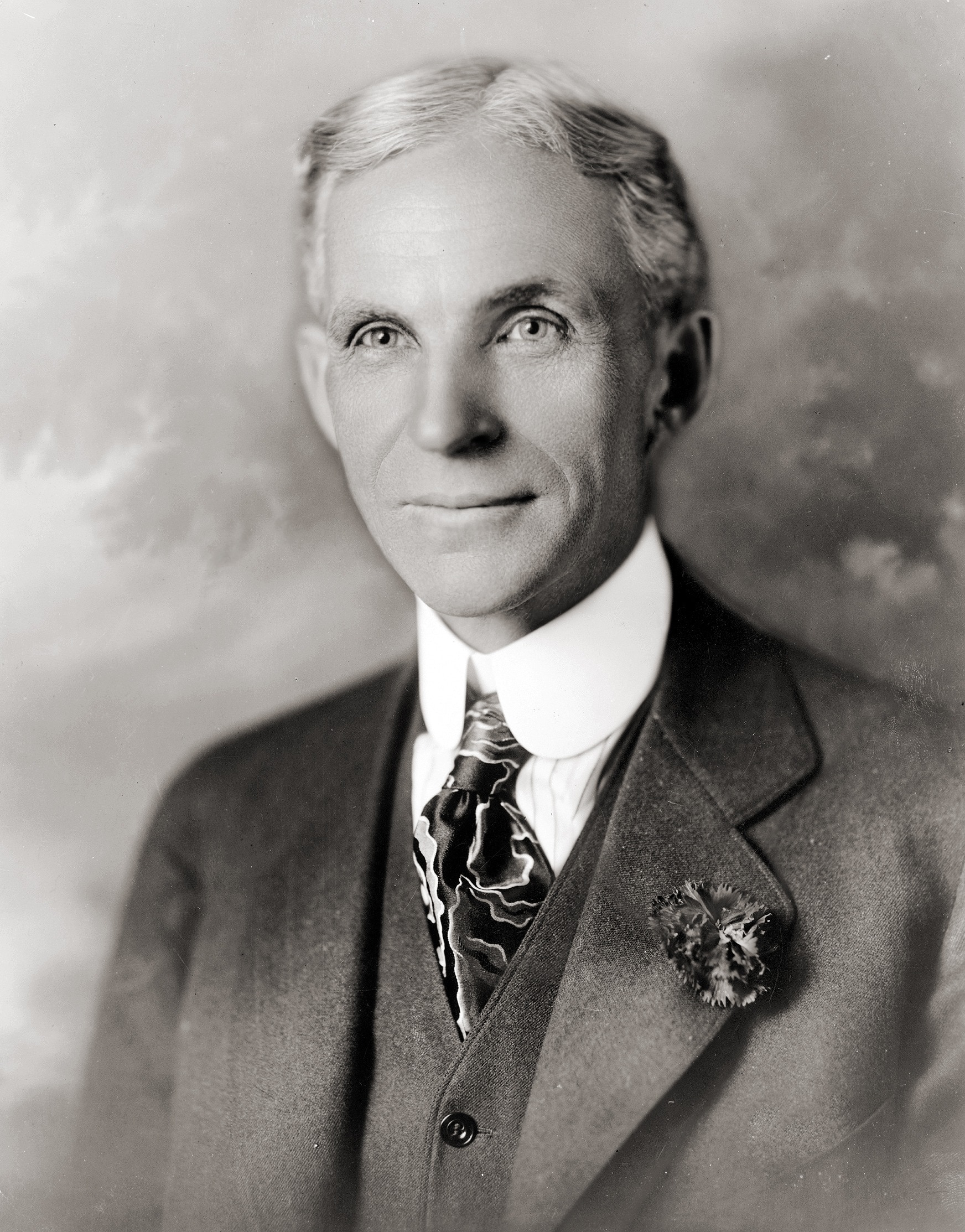man wearing four-piece suit in gray scaled photography