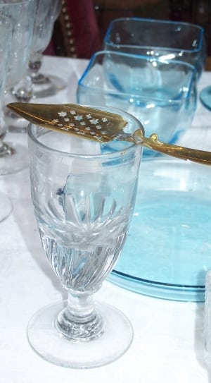 brass cake server and clear short stem wine glass thumbnail