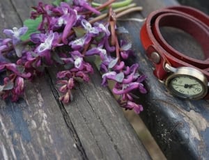 purple flowers and brown strap watch thumbnail