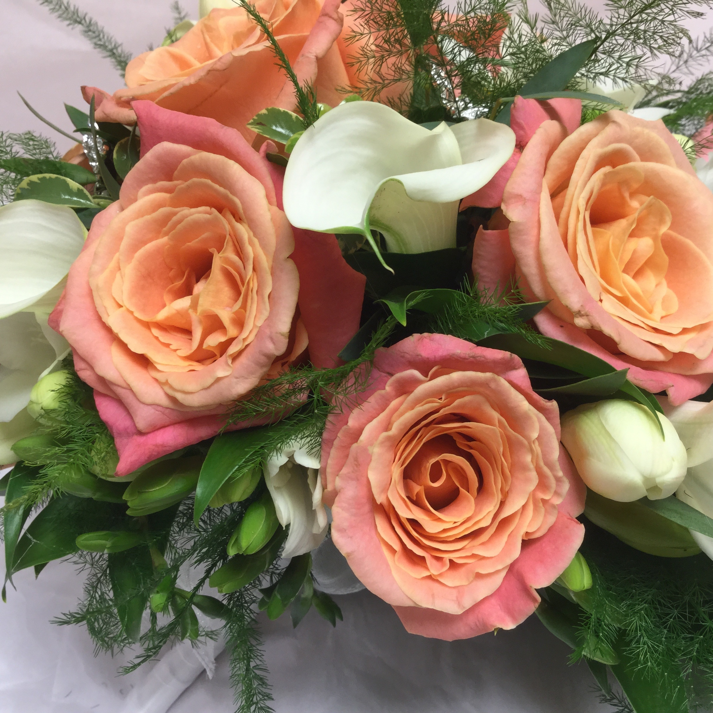 orange white and pink bouquet of flower