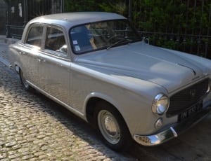 silver vintage sedan thumbnail