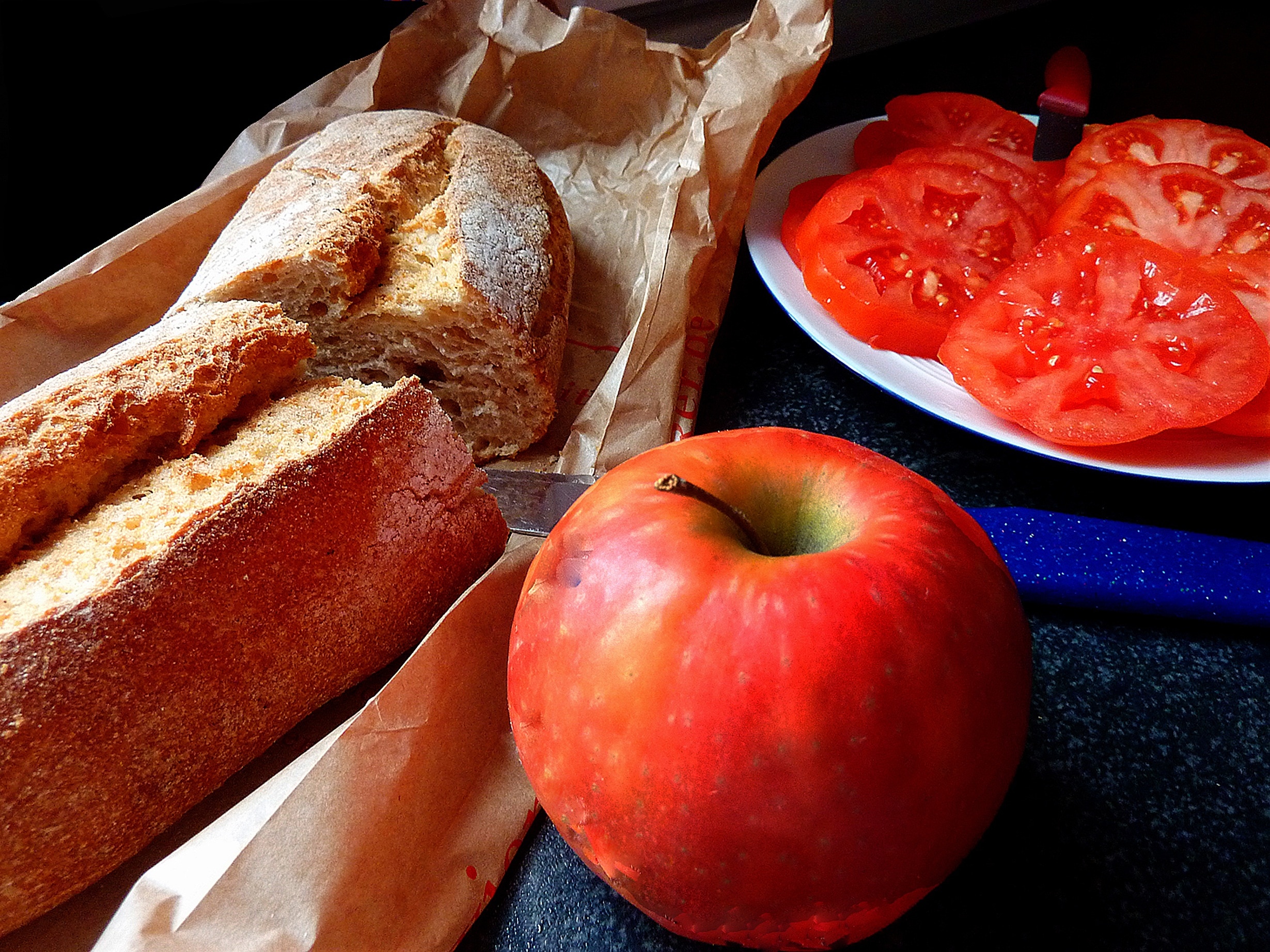 bread, apple and sliced tomatoes