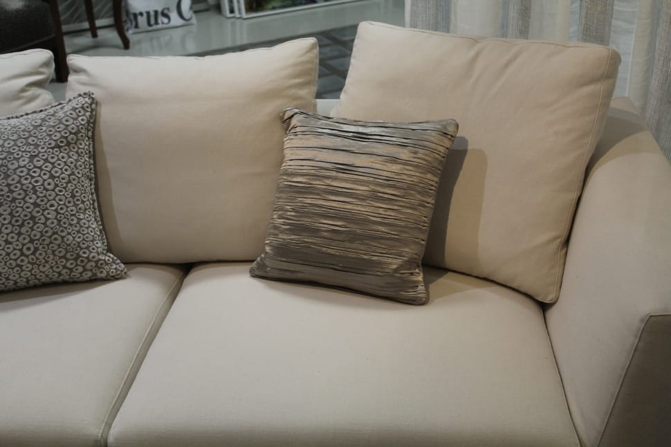 beige fabric loveseat with throw pillows preview