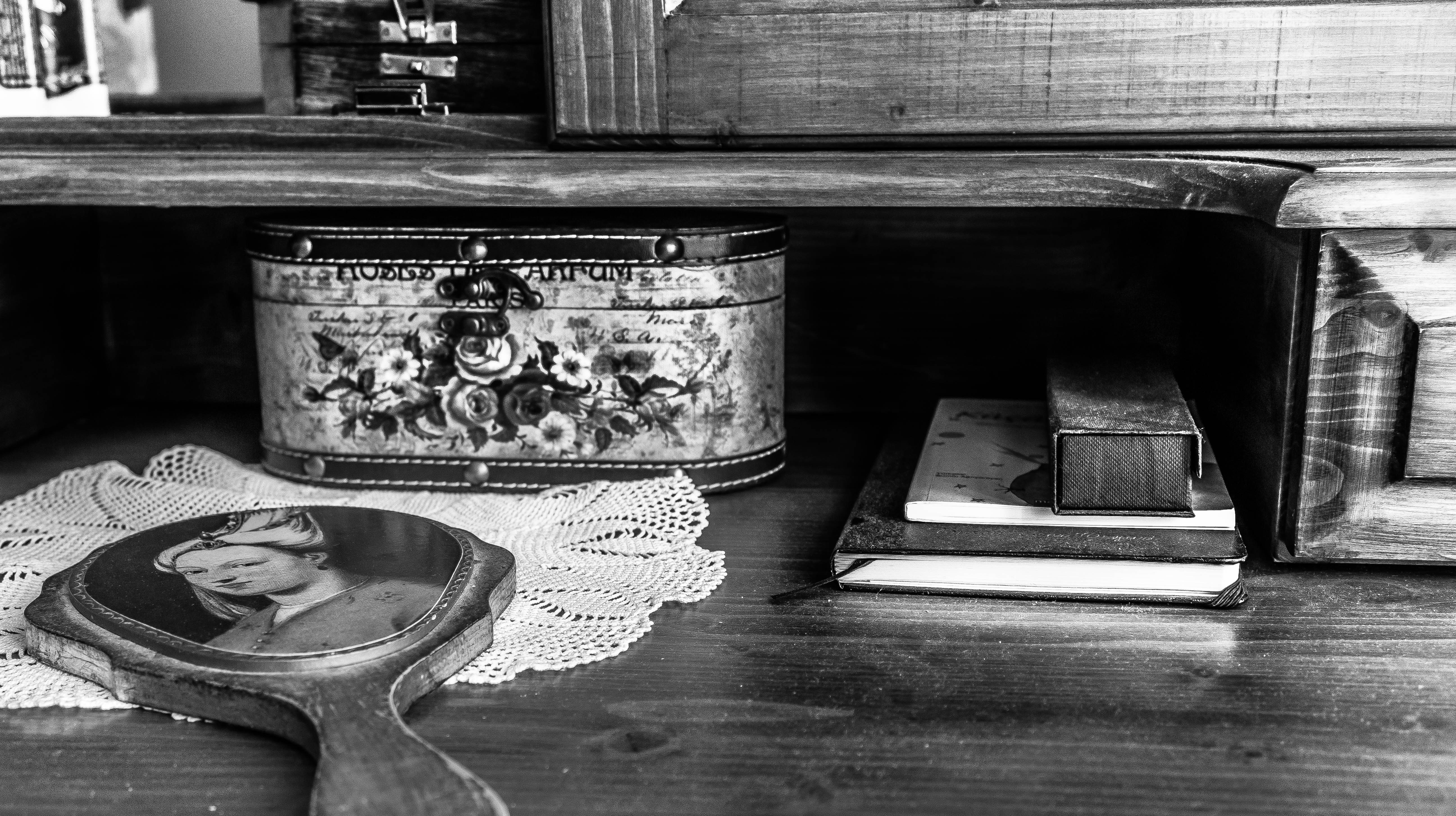 table with assorted items grayscale phot