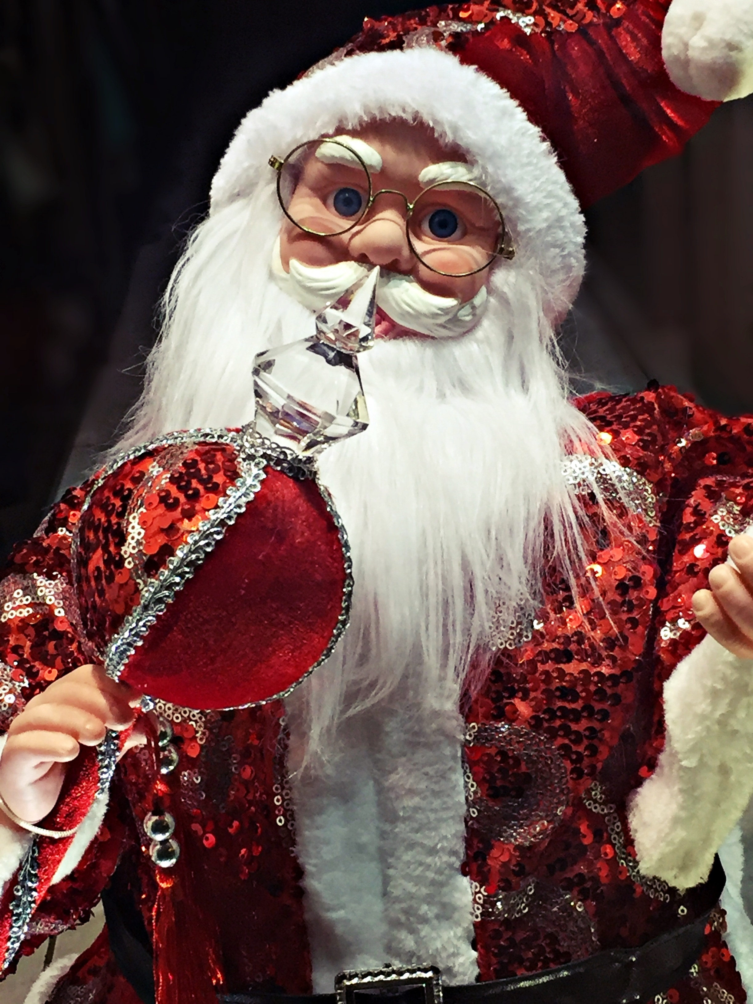 Santa Claus holding a rod