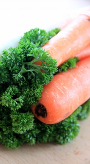 green leafy vegetable and 2 carrots thumbnail