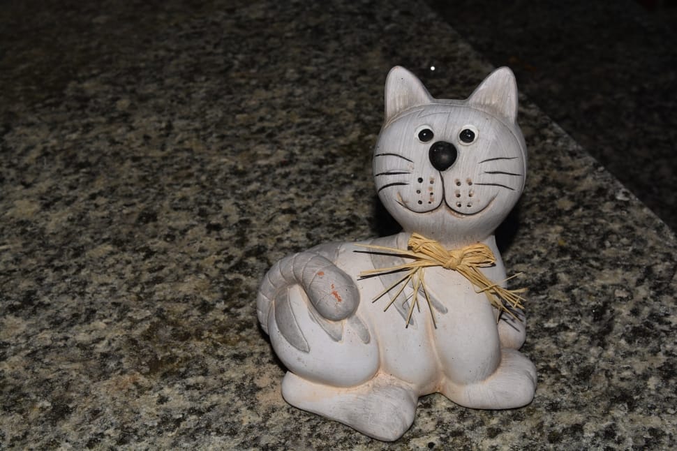 beige and gray cat figurine preview