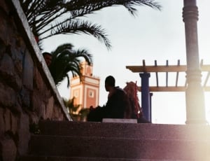silhouette of man sitting white bench thumbnail