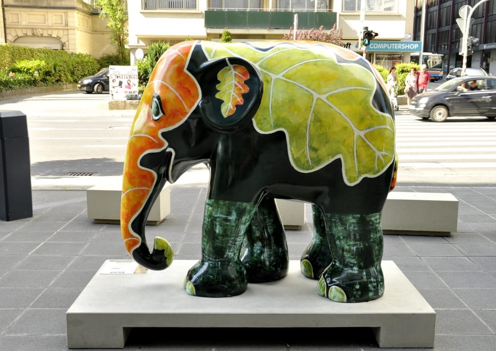 green black and orange leaf elephant ceramic figurine preview