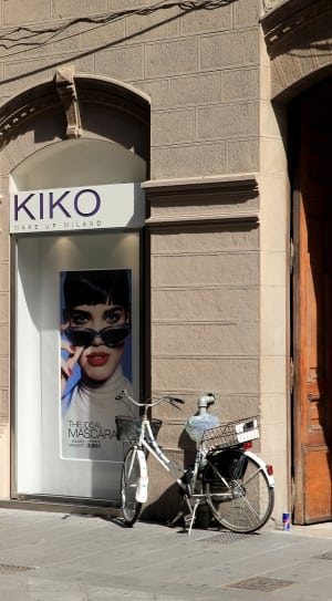 KIKO signage with white cruiser bicycle parking in front thumbnail
