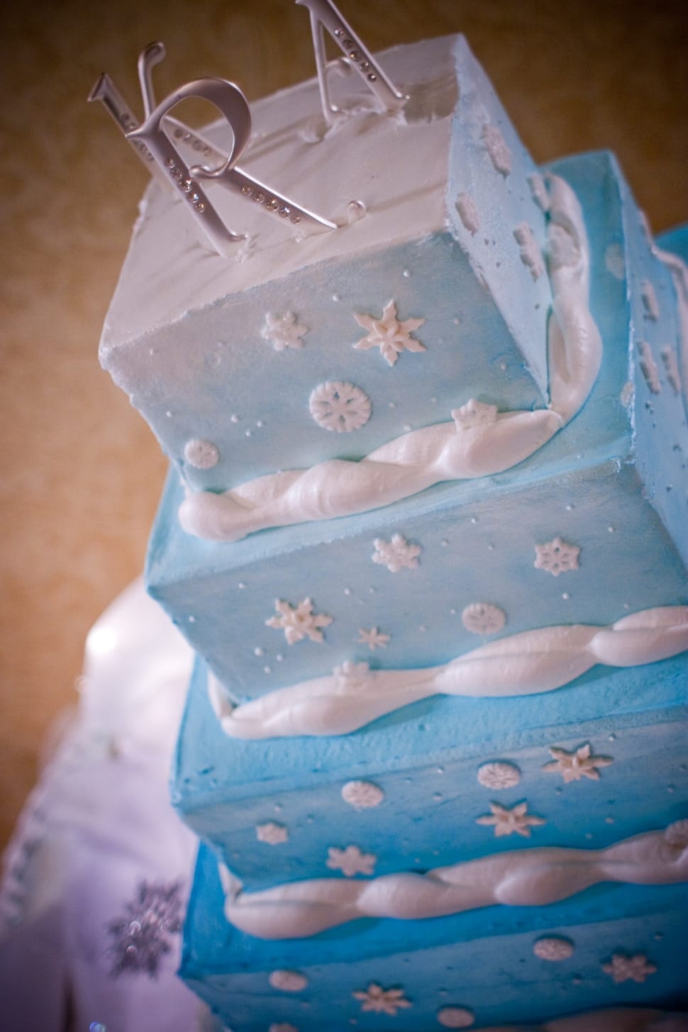 white and blue 4 layered fondant cake preview