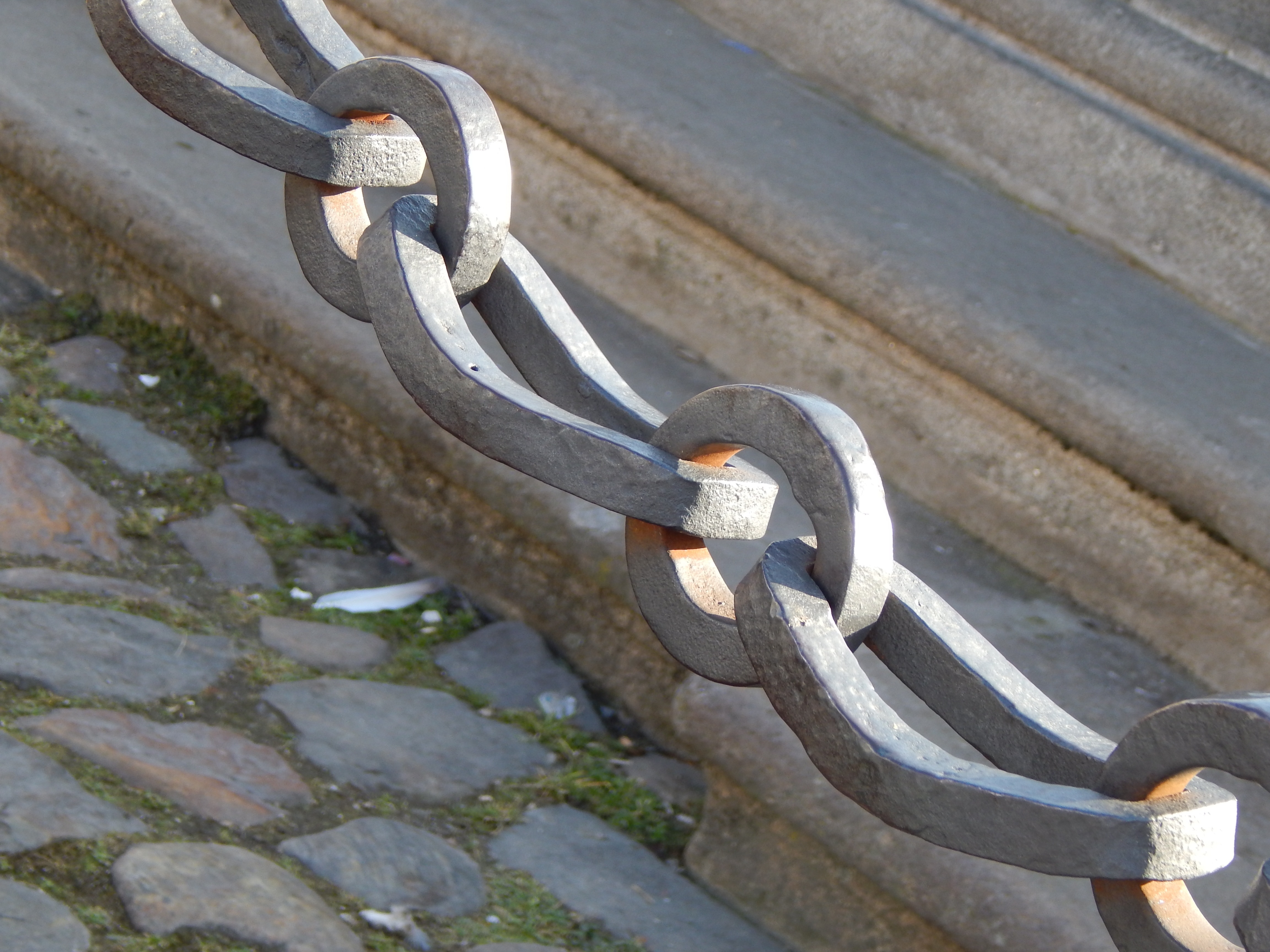 grey metal chain link barrier