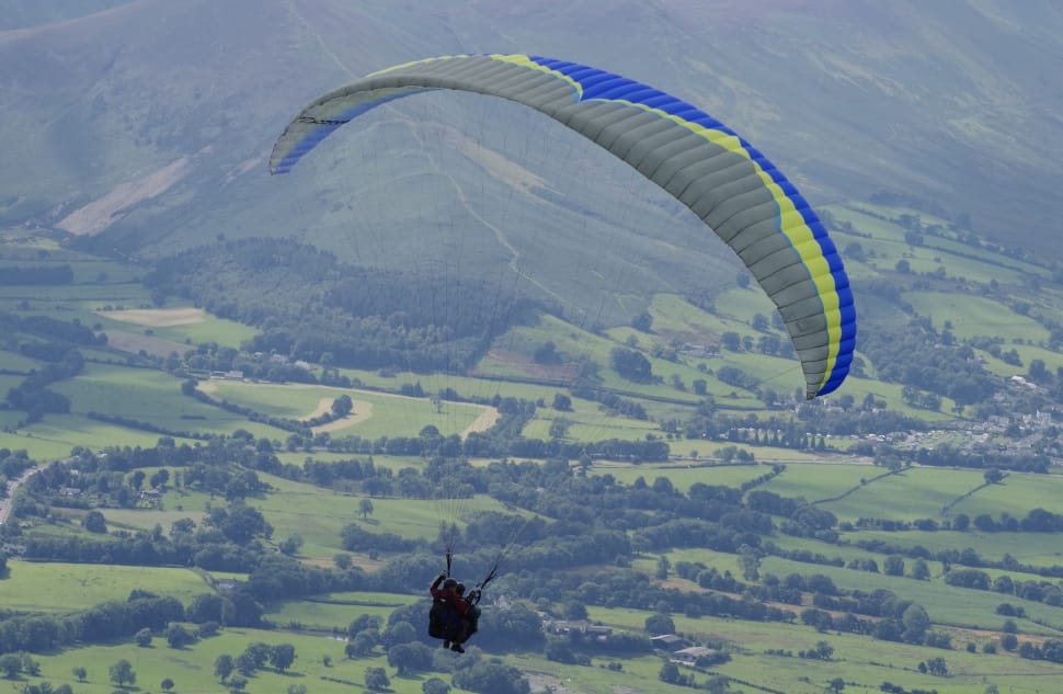 gray yellow and blue paragliding preview