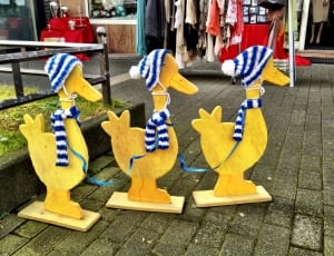 three wise brown wooden ducks standee thumbnail