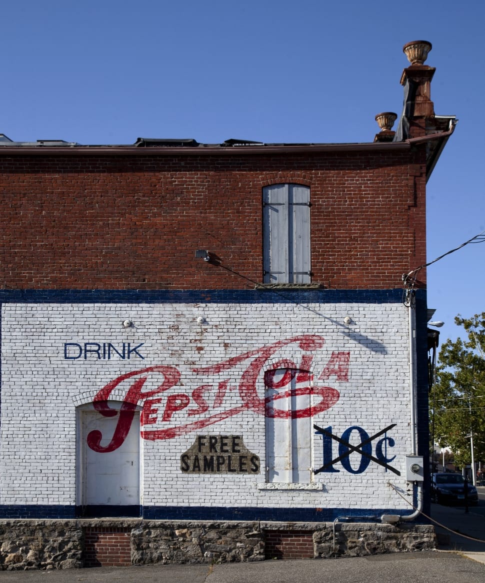 white red and brown pepsi cola printed concrete building preview