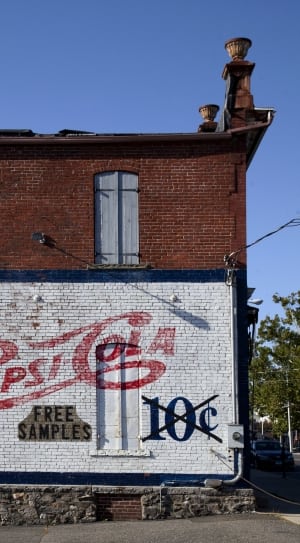 white red and brown pepsi cola printed concrete building thumbnail