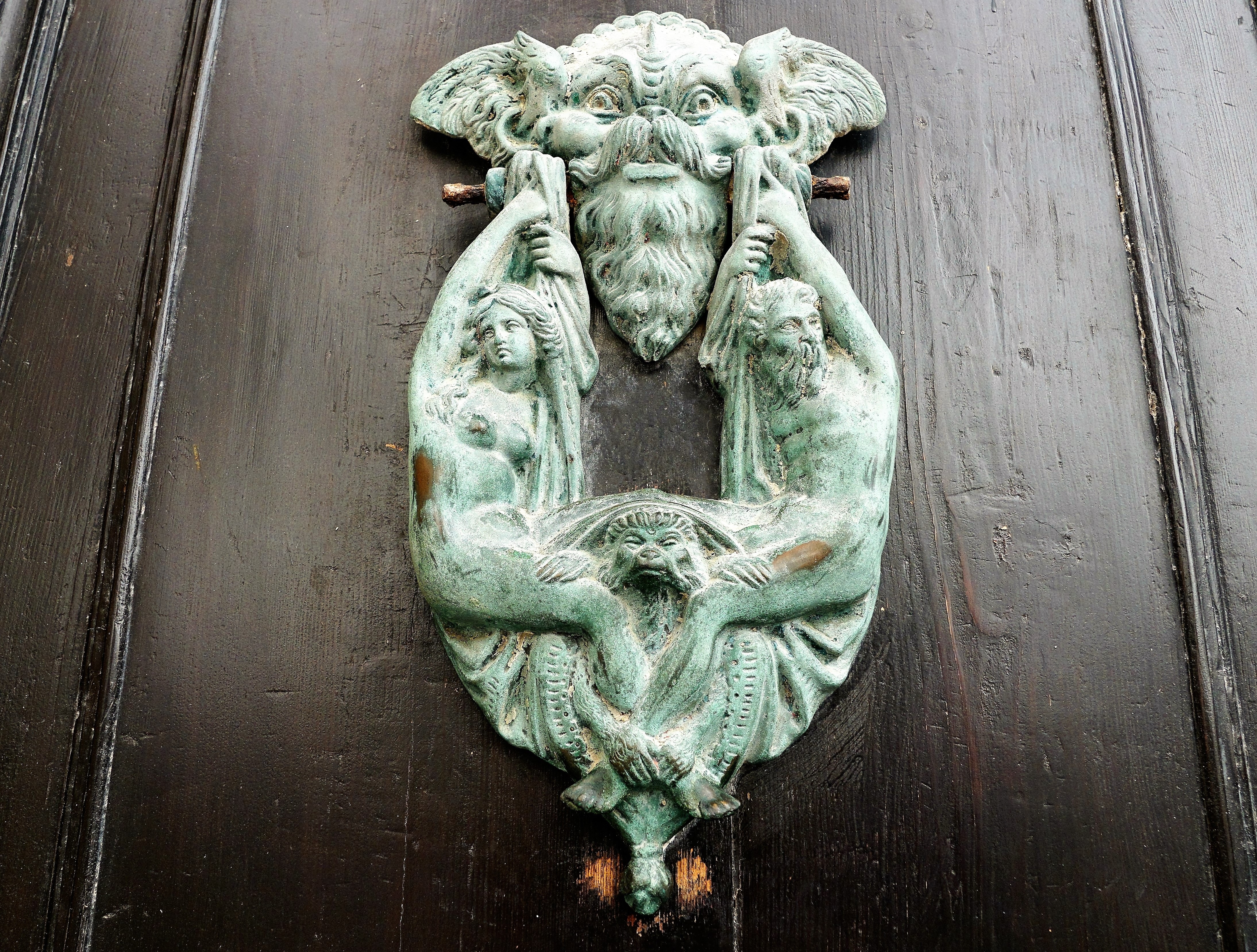 demon and people door knocker