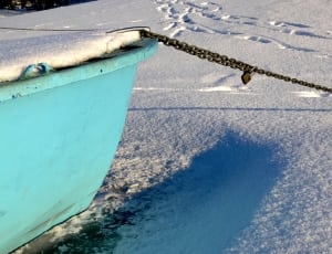 blue boat with brown steel chains thumbnail