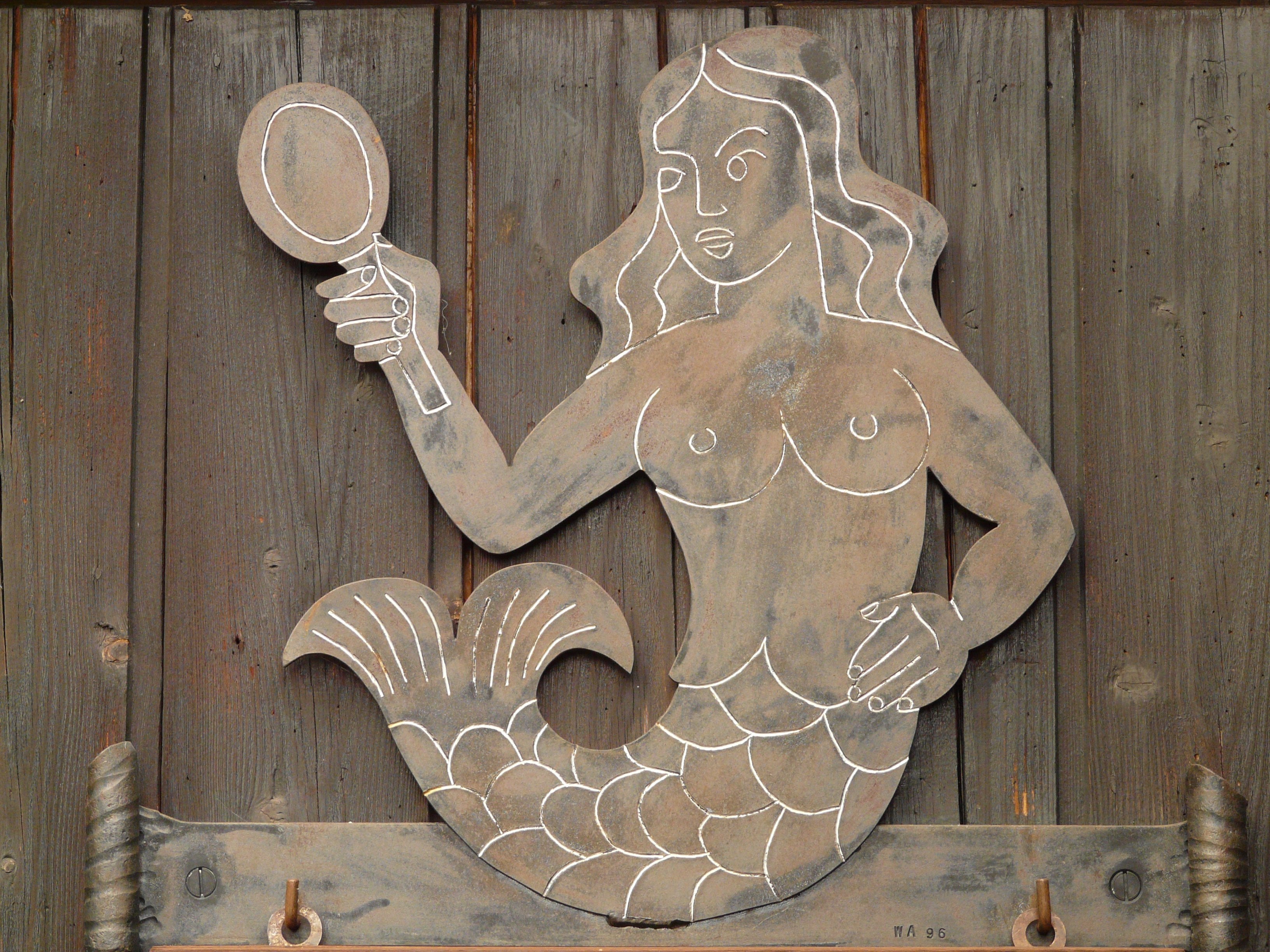 mermaid brown wooden signage