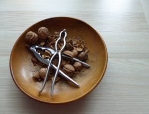 brown walnuts and silver nutcrackers thumbnail