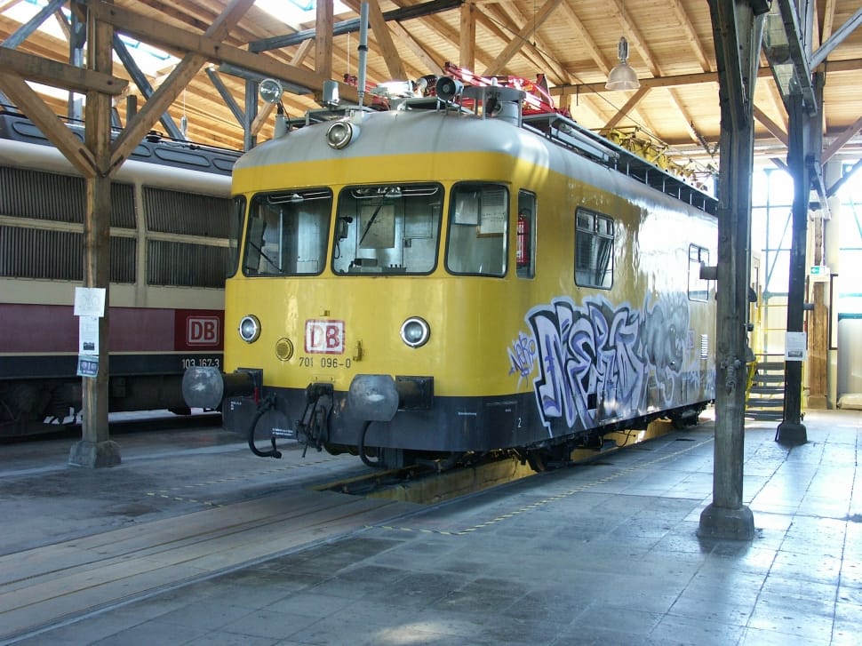 yellow, white, black graffiti painted train preview