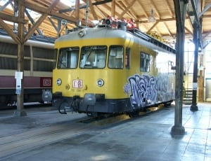 yellow, white, black graffiti painted train thumbnail
