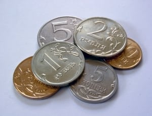 silver-and-gold round coins thumbnail
