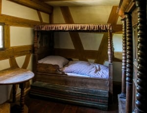 brown wooden canopy bed thumbnail